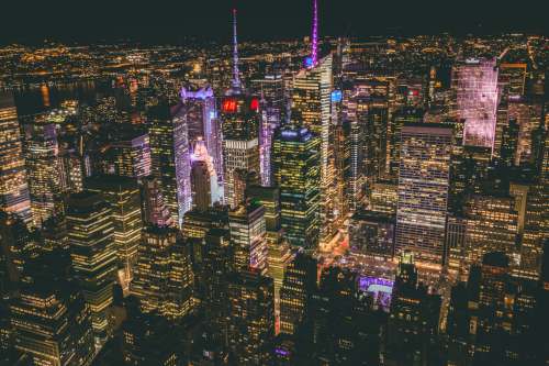 new york aerial photography of city buildings during nighttime 